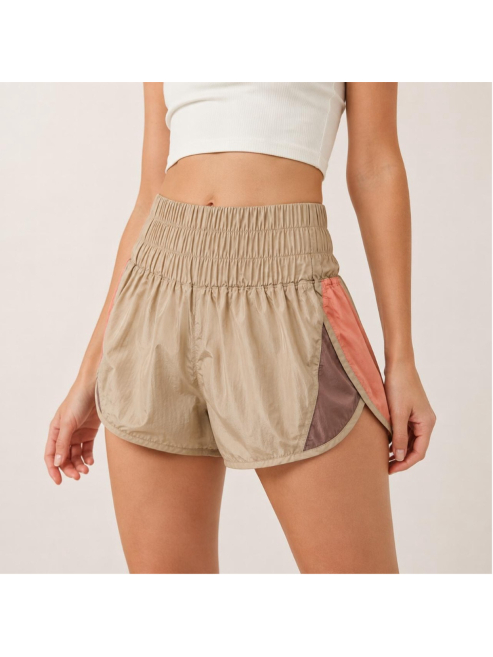 Free People Movement shorts with beige, coral, and mauve color blocking
Size M
#